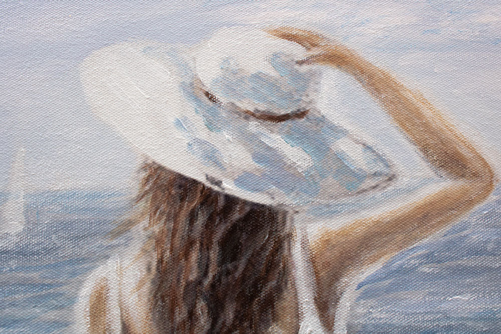 U boho stilu slika na platnu s motivom ŽENA I MORE, okean, plaža, šešir, more i plaža u bijelo-bežih nijansama, mirna atmosfera, pogodan za hodnika – proizvod